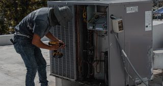 man-repairing-air-conditioning